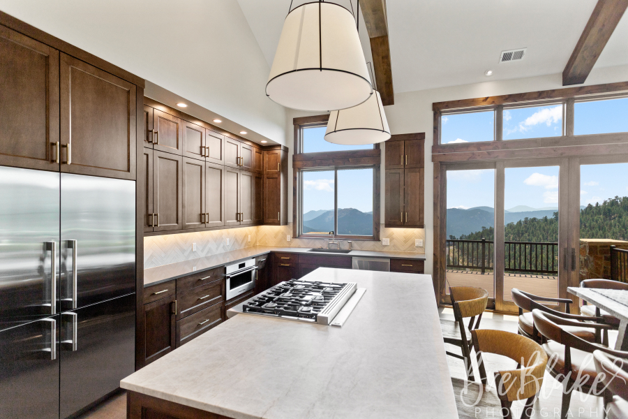 Kitchen island with an inset range facing broad foothills views