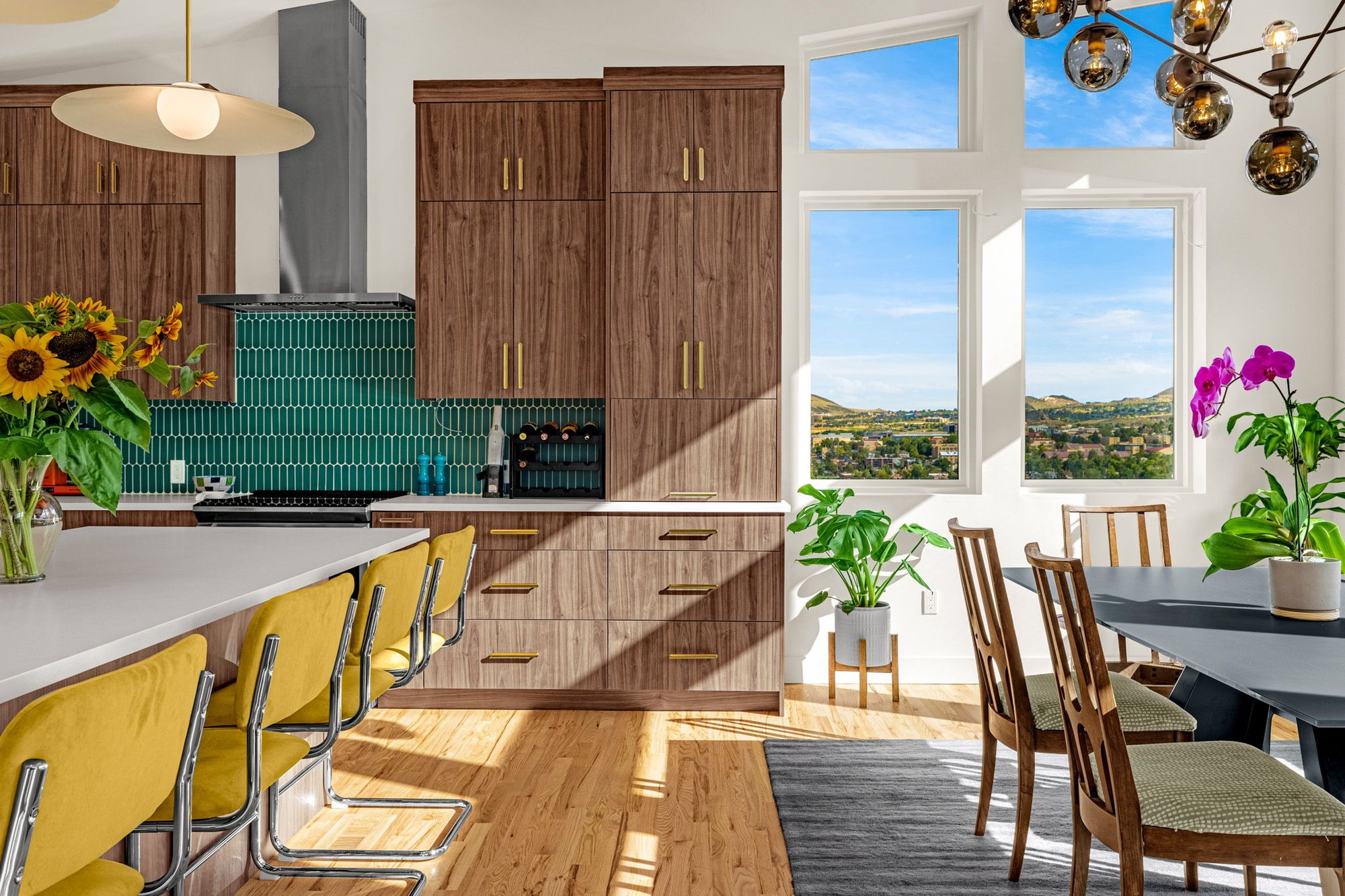 View from the kitchen through to the dining area and the foothills beyond