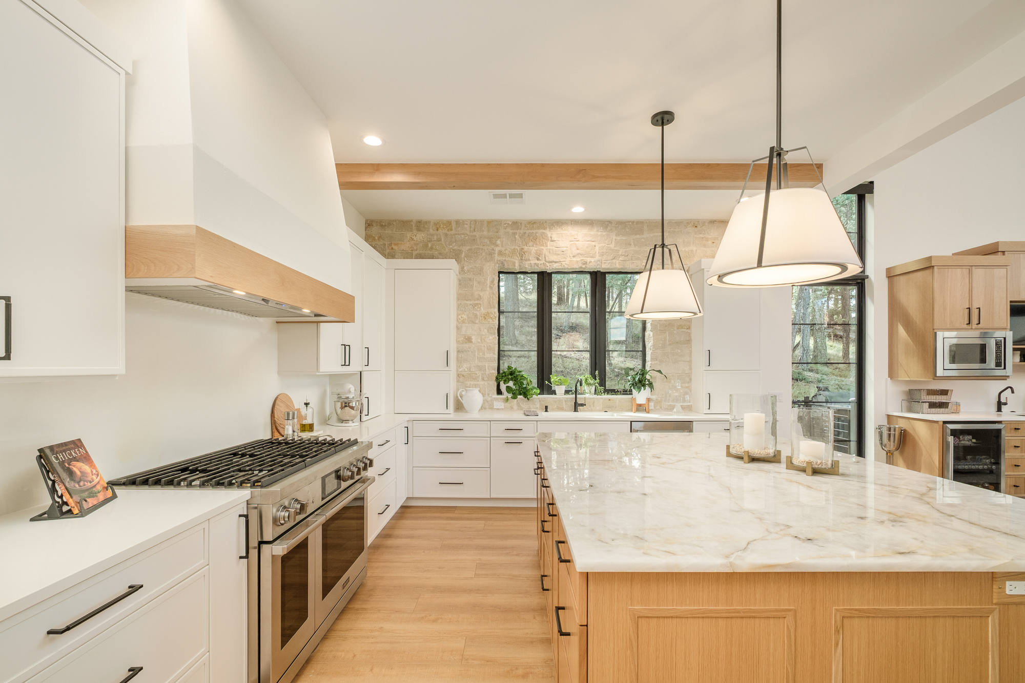 White and oak kitchen with a large stone-topped island