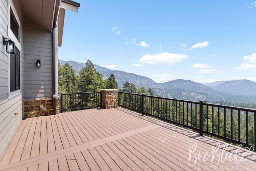 Composite deck with black steel railing overlooking the Evergreen foothills