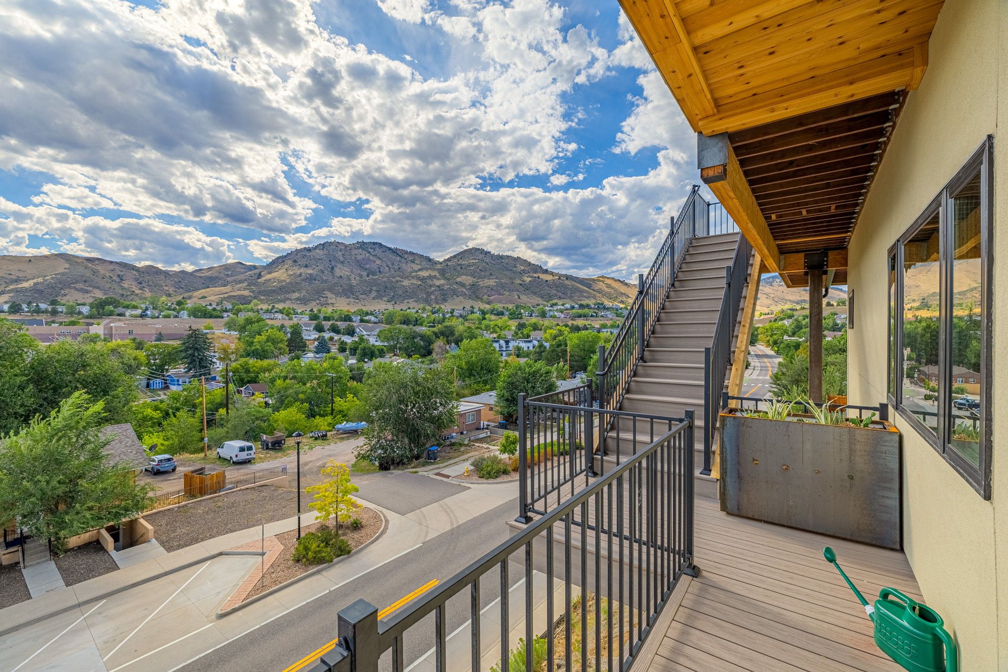 Exterior deck and stair connecting two levels of the house