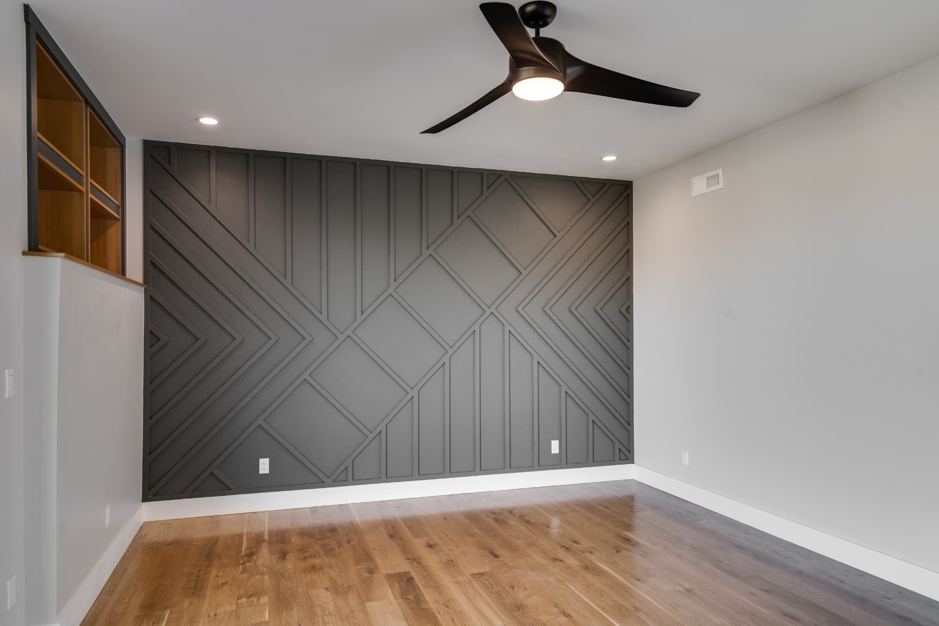 Wide view of the bedroom accent wall in painted trim work